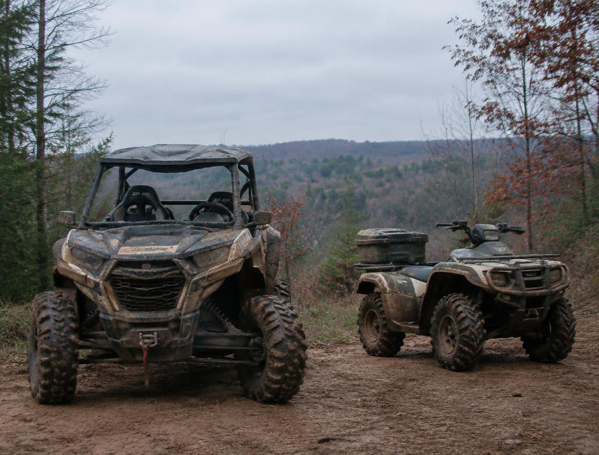 Side-by-side UTV and ATV on a Michigan trail